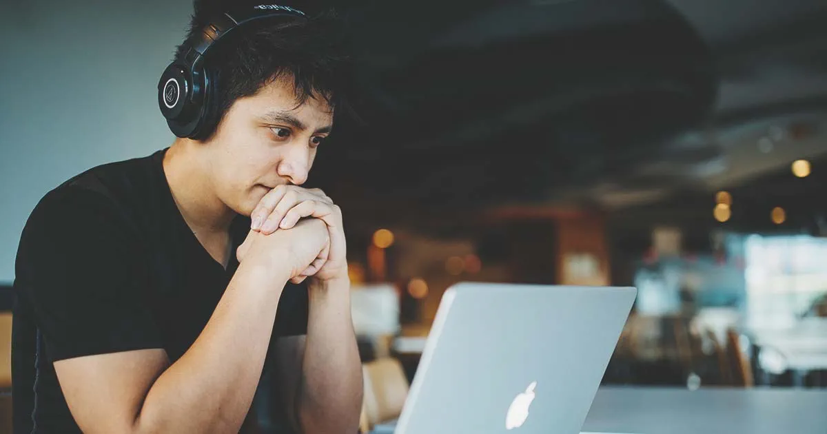 AEM developer working on a laptop