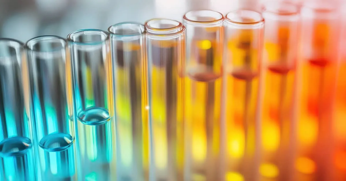 Close-up of colorful test tubes representing experimentation