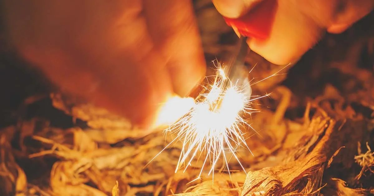 Person starting a fire representing getting started developing on AEM