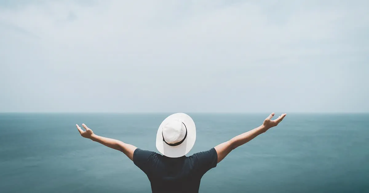 Man with outstretched arms welcoming the latest Sitecore XP release