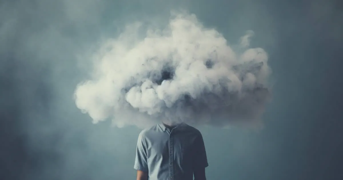 Man wearing a suit with a cloud for a head.